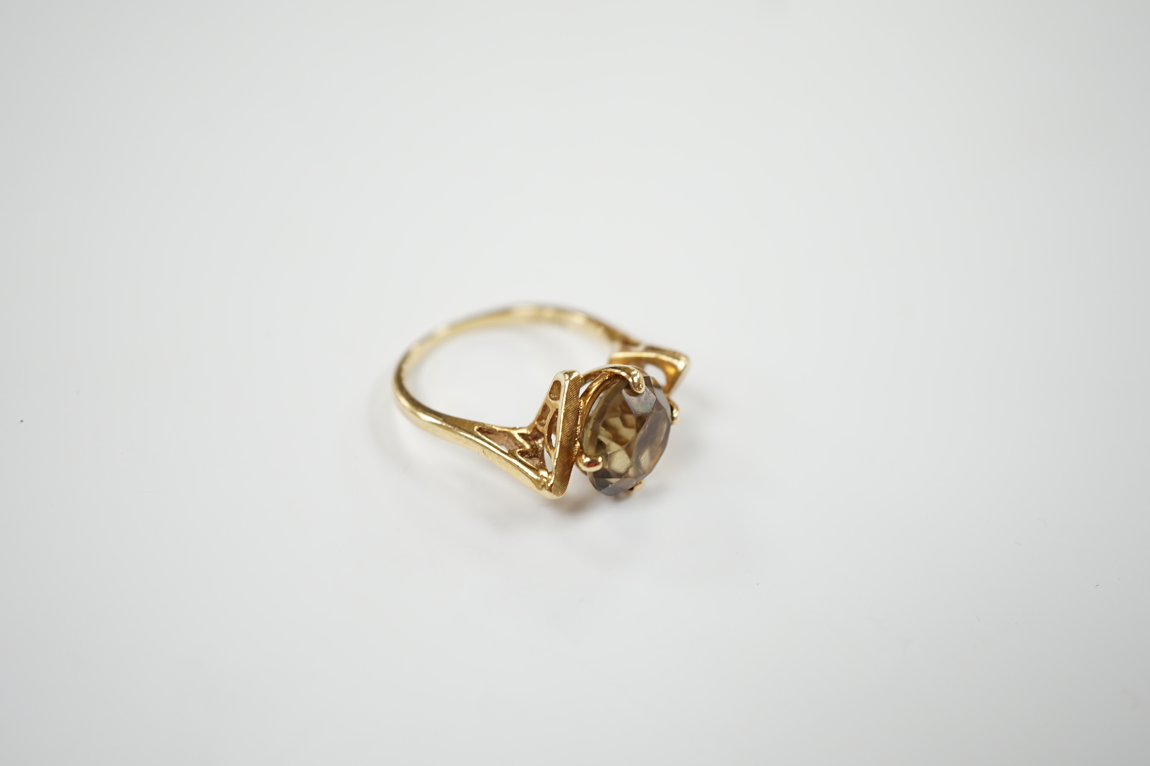 A 14k yellow metal and single stone citrine set dress ring, size N/O, gross weight 3.9 grams.